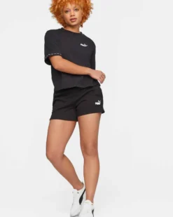 PUMA - Pantaloncini corti da donna neri con logo bianco e stampa logo laterale