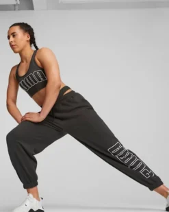 PUMA - Top imbottito nero in tessuto traspirante con logo bianco