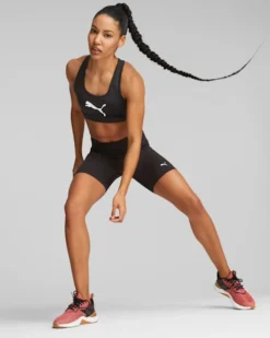 PUMA - Top nero in tessuto traspirante con logo nero