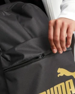 PUMA - Zaino nero e oro con tasca laterale e spallacci imbottiti regolabili